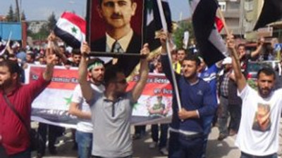1 Mayıs'ta Esad'a destek sloganları