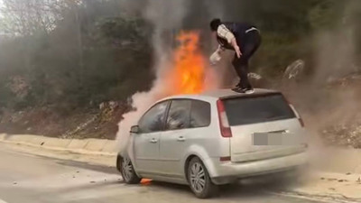 Aracının alev topuna döndüğünü görünce canını hiçe saydı