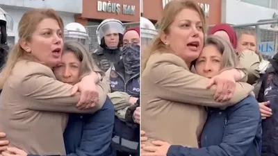 Kadın muhtar gözaltına alınmasın diye sıkı sıkıya sarıldı!