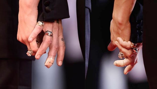 Johnny Depp ve Amber Heard kırmızı halıda el ele göz göze
