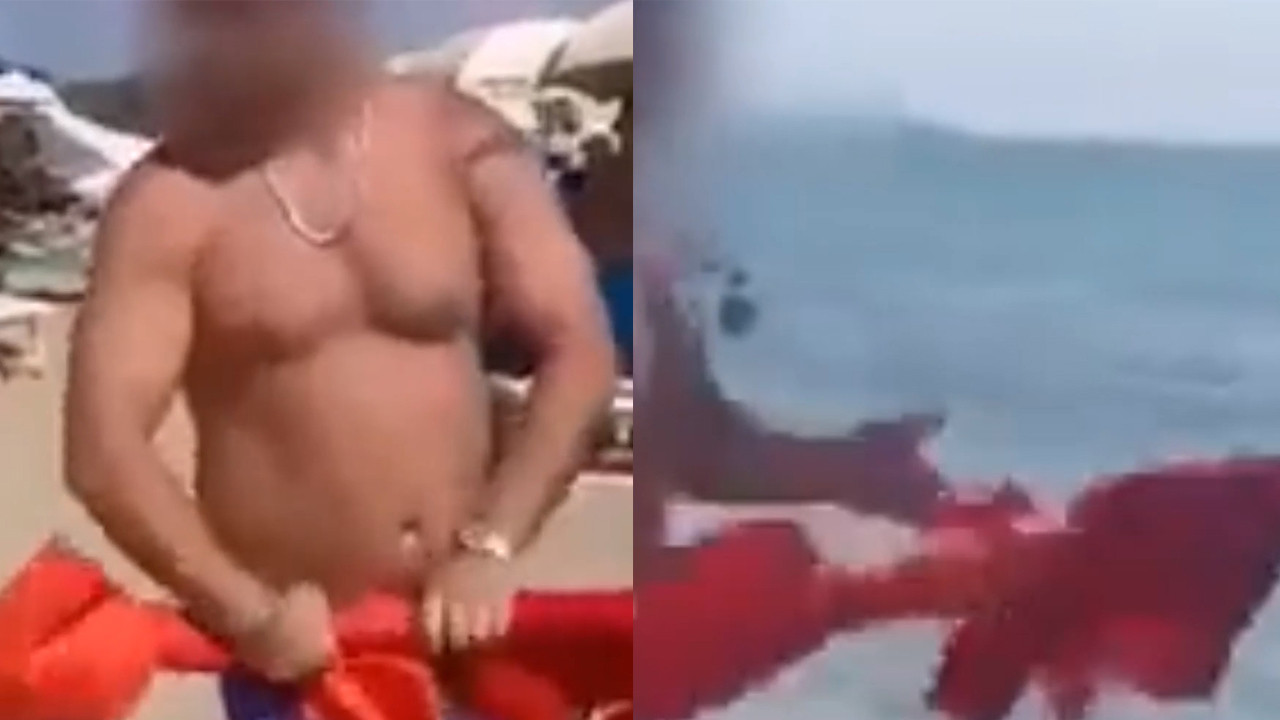 Plajda Türk Bayrağı'na saldırı! Bayrağı indirip denize attı