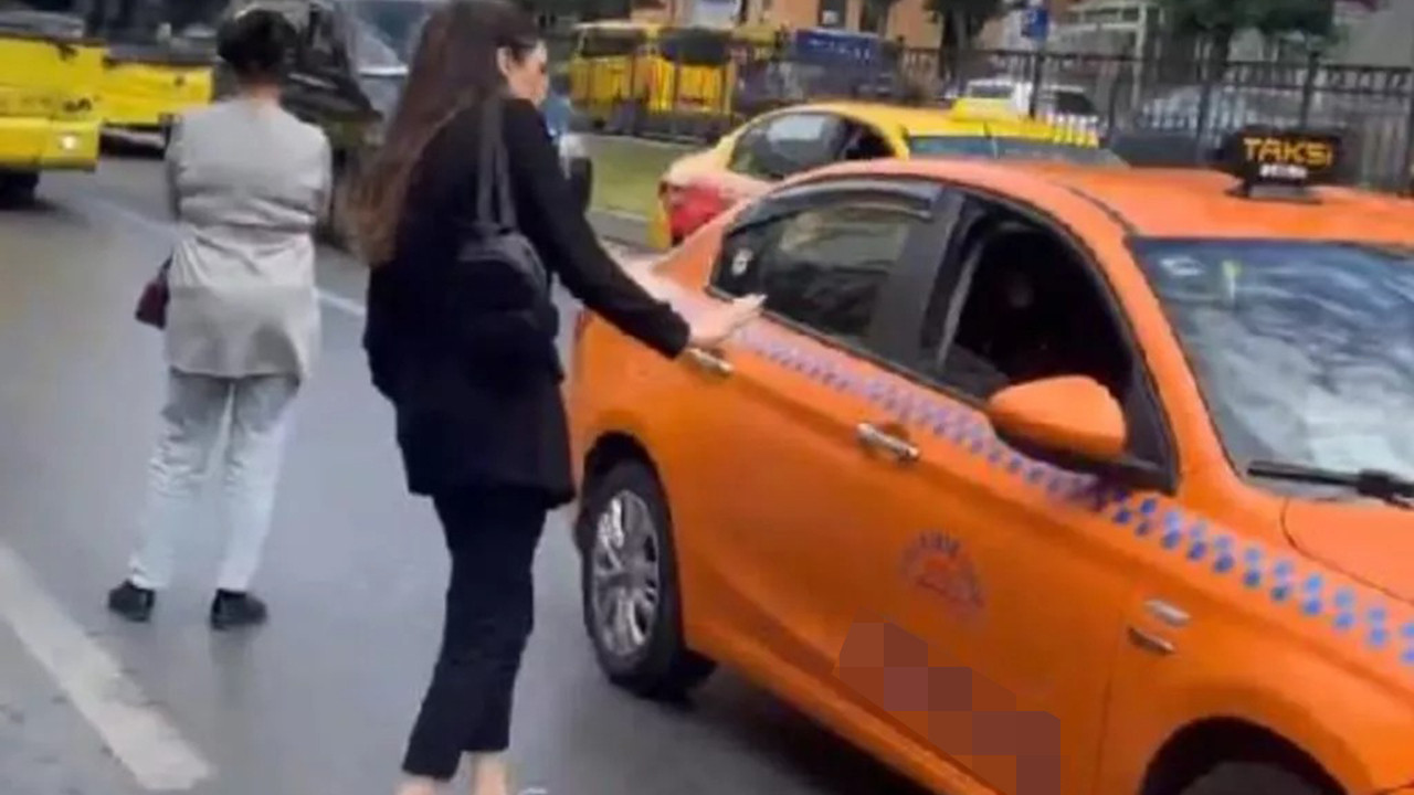 Kadın yolcudan parasını isteyen taksi şoförüne yumruk